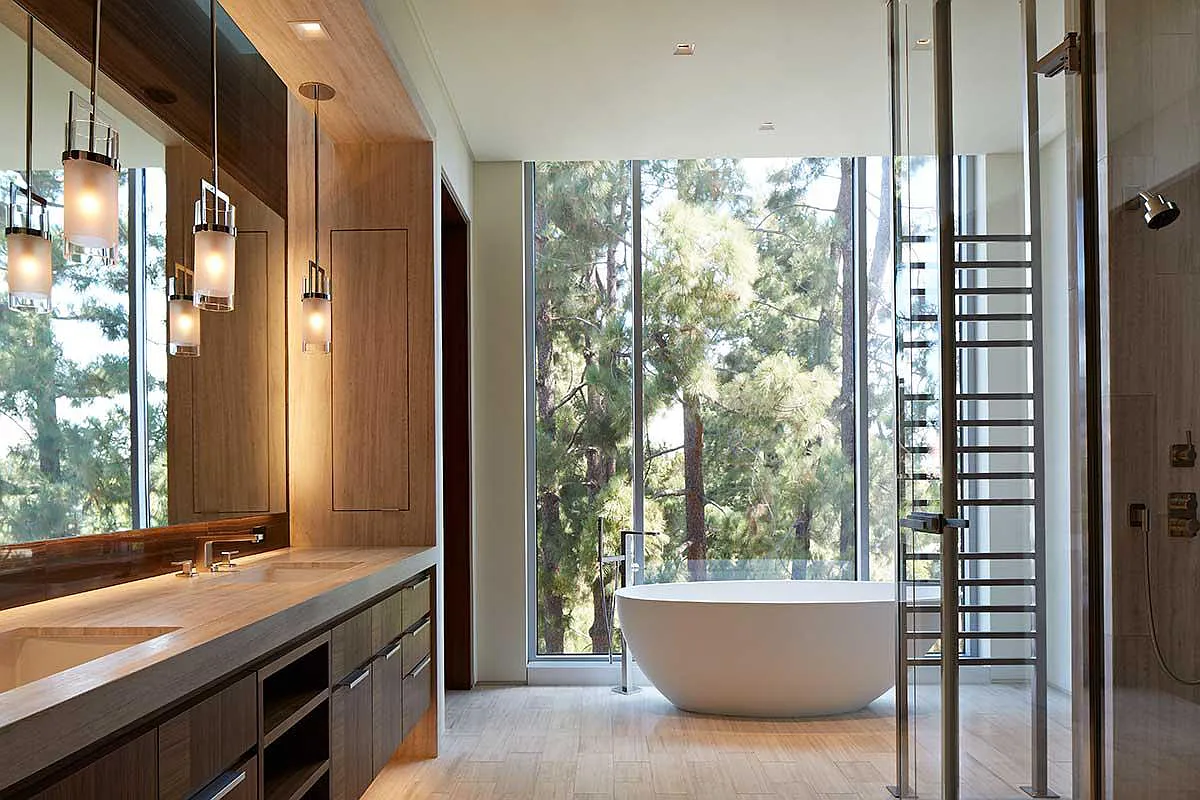Bathroom that is heated and cooled via a radiant ceiling.